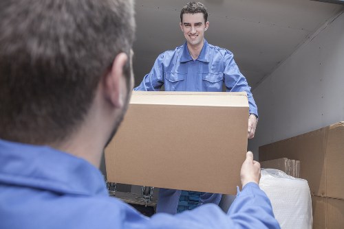 House removals planning in Downham with moving boxes and checklist