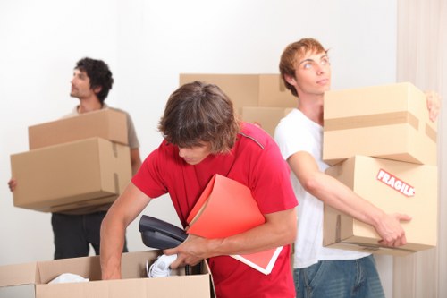 Packed moving boxes prepared for a man and van in Downham