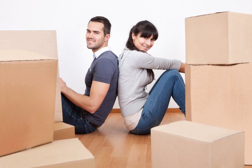 Professional removal team handling furniture during a Downham house move